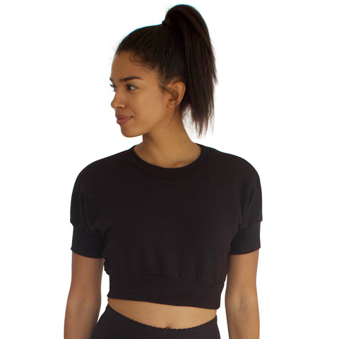 The Anita crop top in Black. Made from 100% cotton French Terry with dolman sleeves and crew neck.