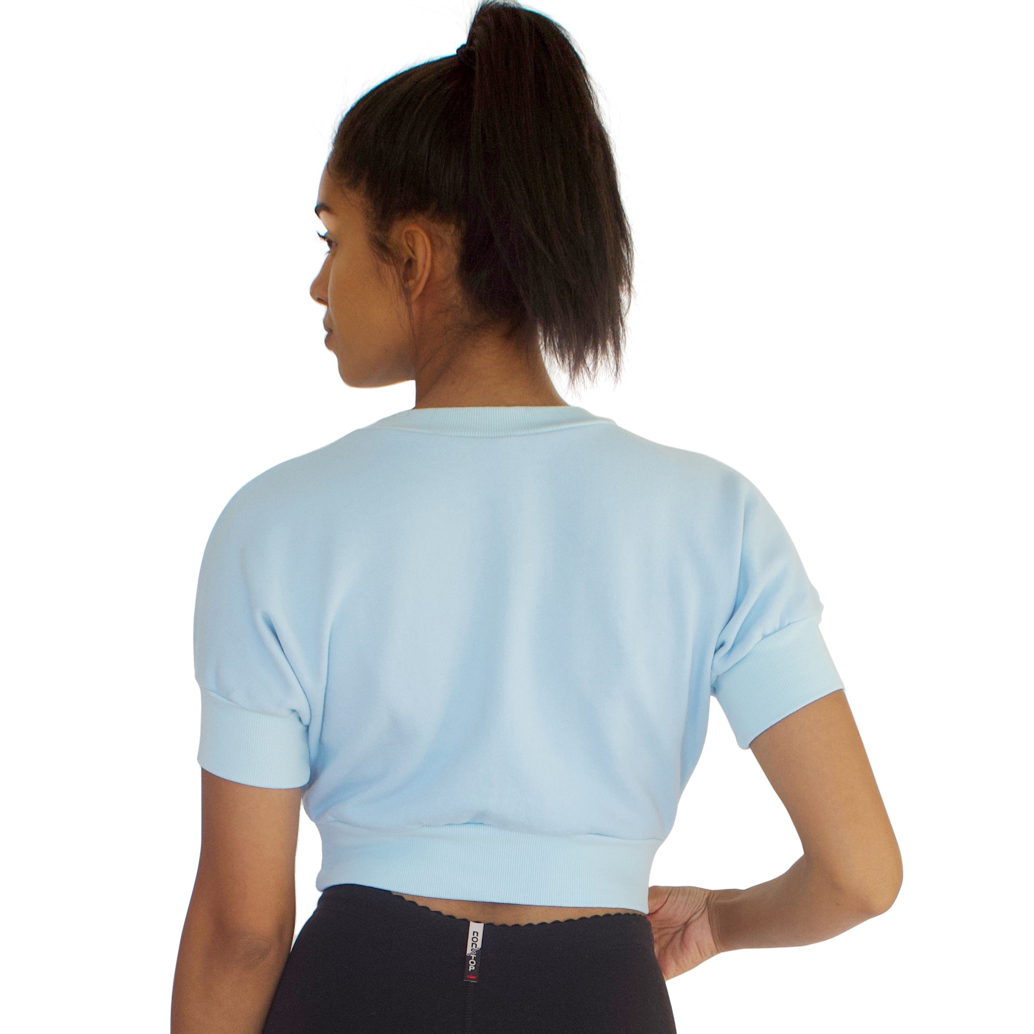 Back view of the 100% cotton French Terry Anita crop top in Sky Blue