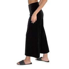 Side view of our Cropped length Stretch Velvet Track Pant in Jet Black has elastic waist and 26" inseam