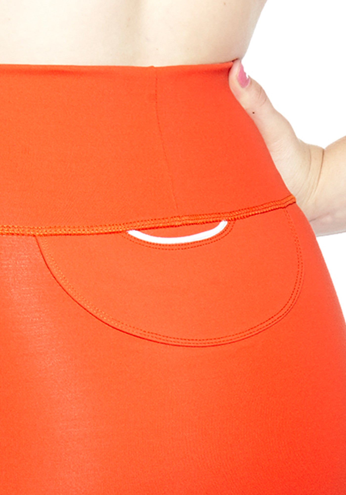 Back pocket close up of comfortable Mini Skirt in thick stretch fabric. Bright Poppy Red with contrast white panel and hem stitch. Back pocket at waist.