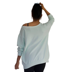 Back view of our our best selling oversized french terry top with raw edge neckline, side seam pockets shown here in Mint Green