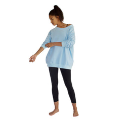 Our best selling oversized french terry top with raw edge neckline, side seam pockets shown here in Sky Blue